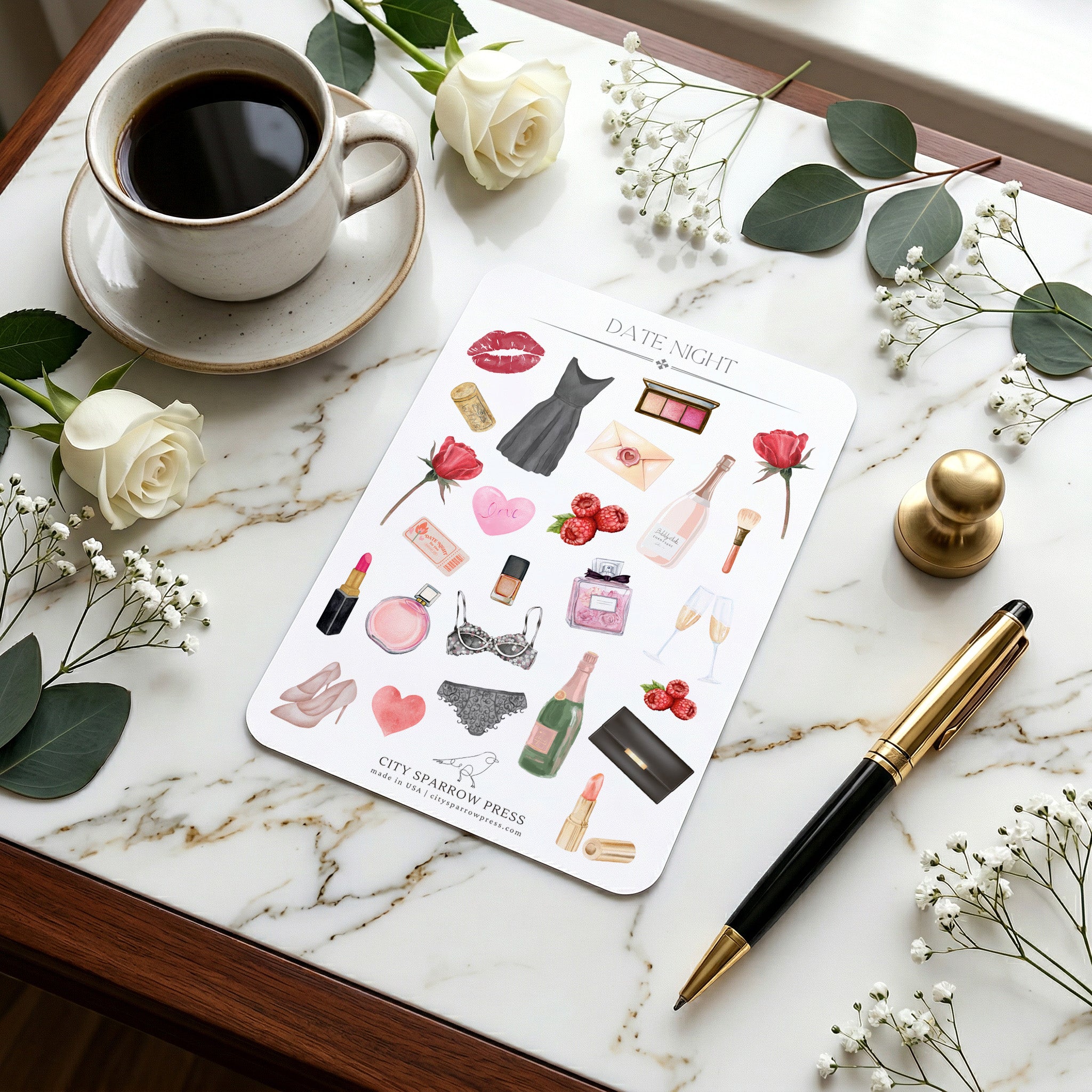 Sticker sheet with fashion-themed designs on a marble surface with coffee and flowers.