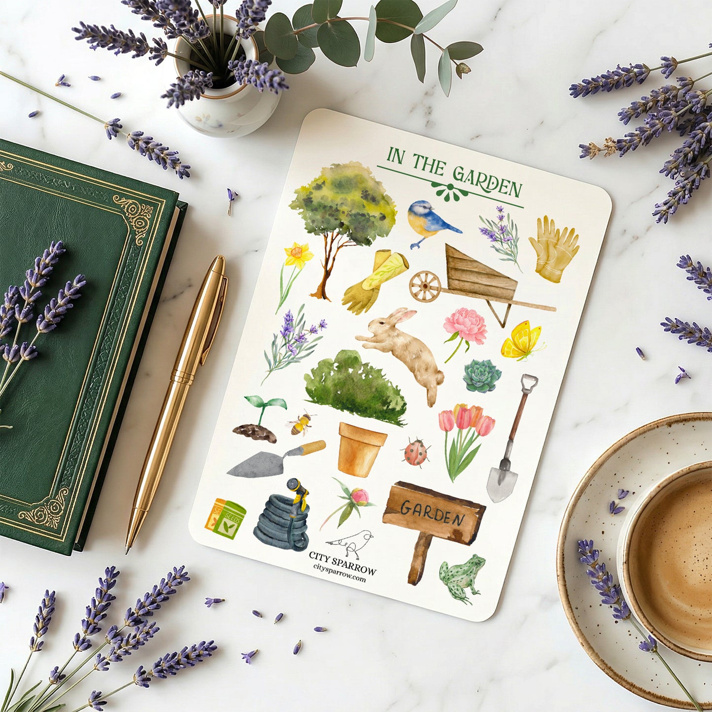 Sticker sheet titled 'In the Garden' with gardening-themed illustrations on a marble surface with lavender and a book.