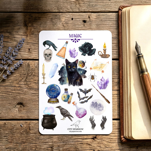 Sheet of mystical stickers with various symbols on a wooden surface with a book and pen.