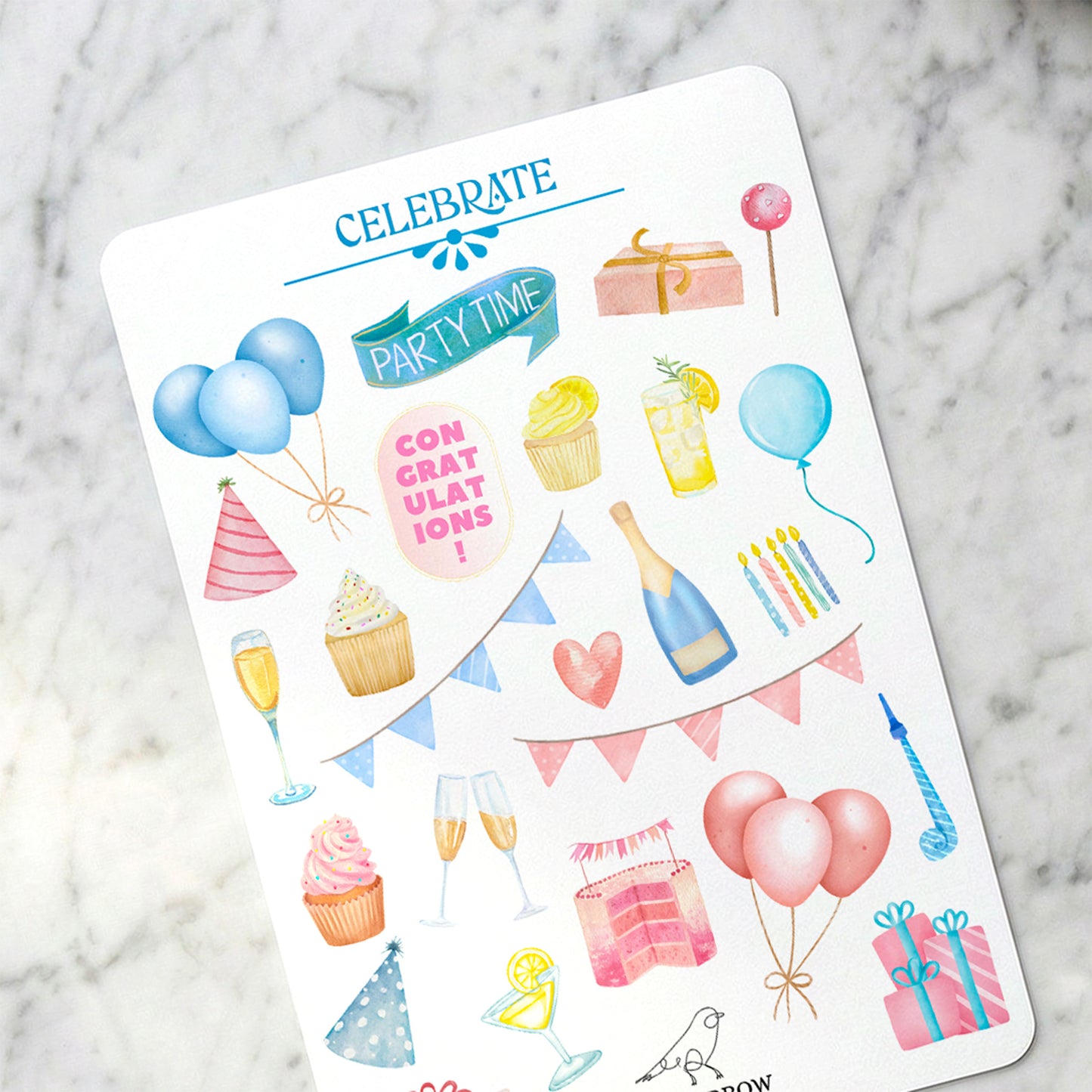 Sheet of birthday-themed stickers on a marble surface