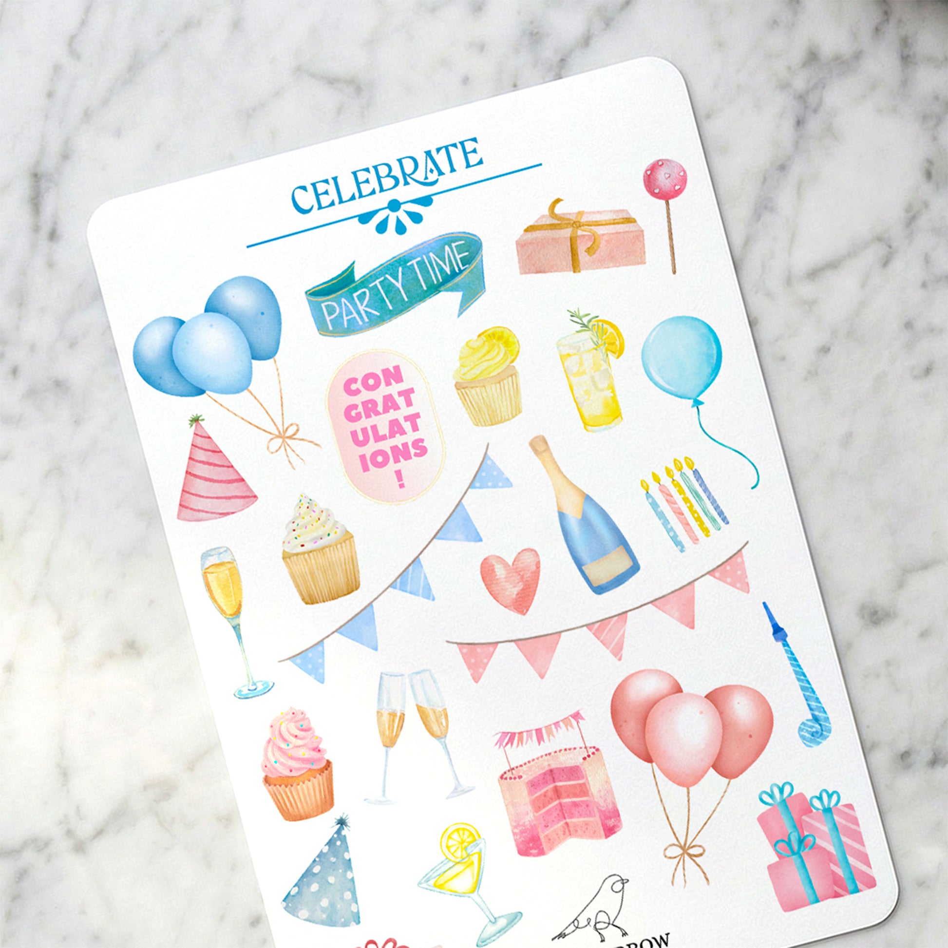 Sheet of birthday-themed stickers on a marble surface
