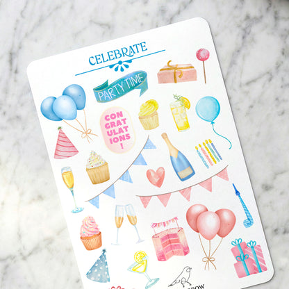 Sheet of birthday-themed stickers on a marble surface