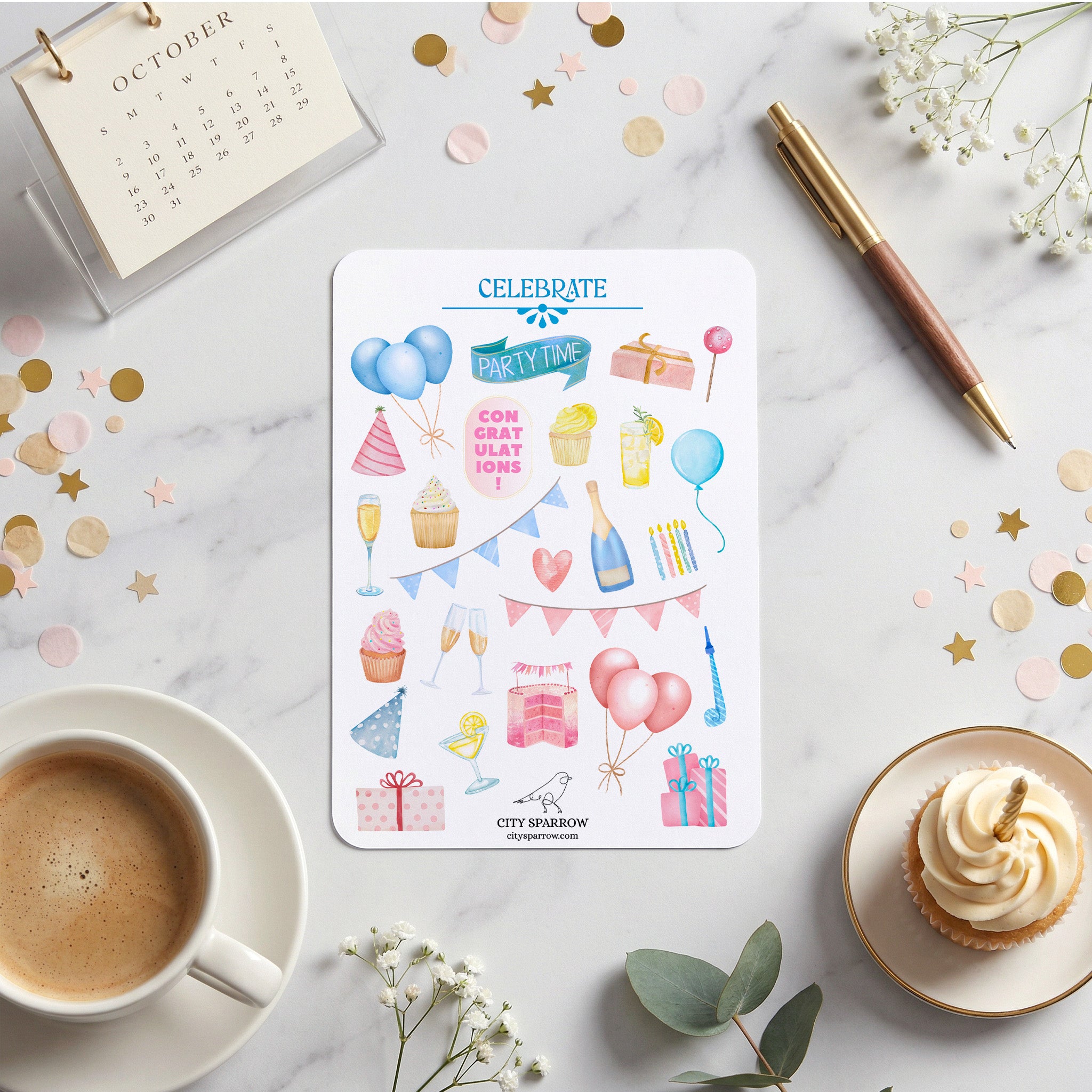 Sticker sheet with party-themed designs on a marble surface with coffee, flowers, and a calendar.