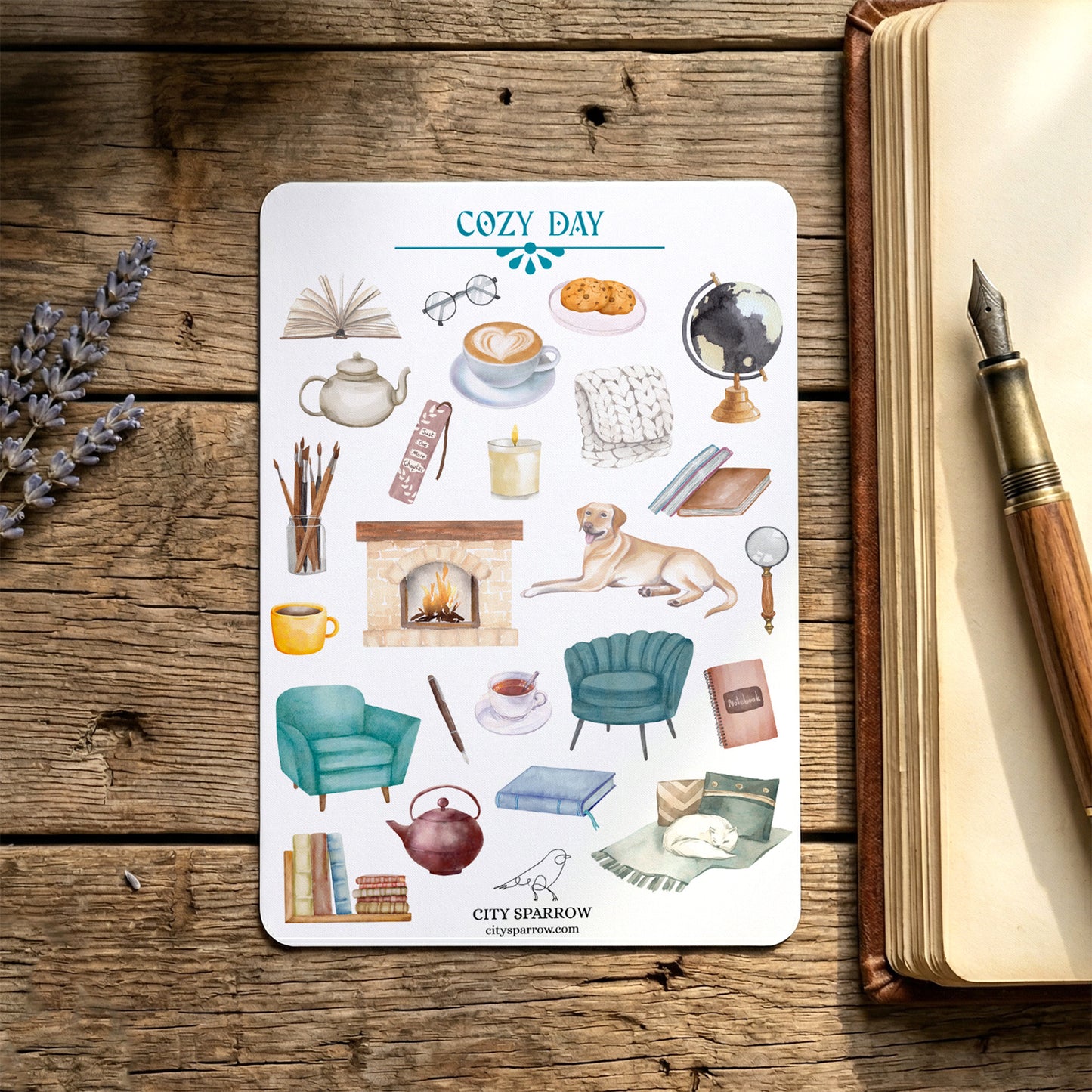 Sticker sheet titled 'Cozy Day' on a wooden surface with a pen and lavender.