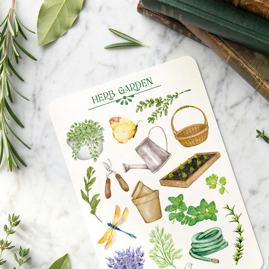 A sticker sheet with herb garden illustrations on a marble surface with herbs and books.