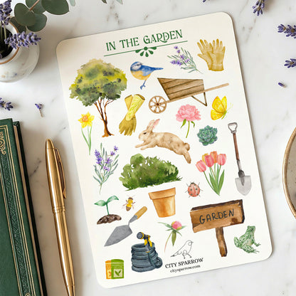 Sticker sheet with garden-themed illustrations on a marble surface with gardening tools and plants.