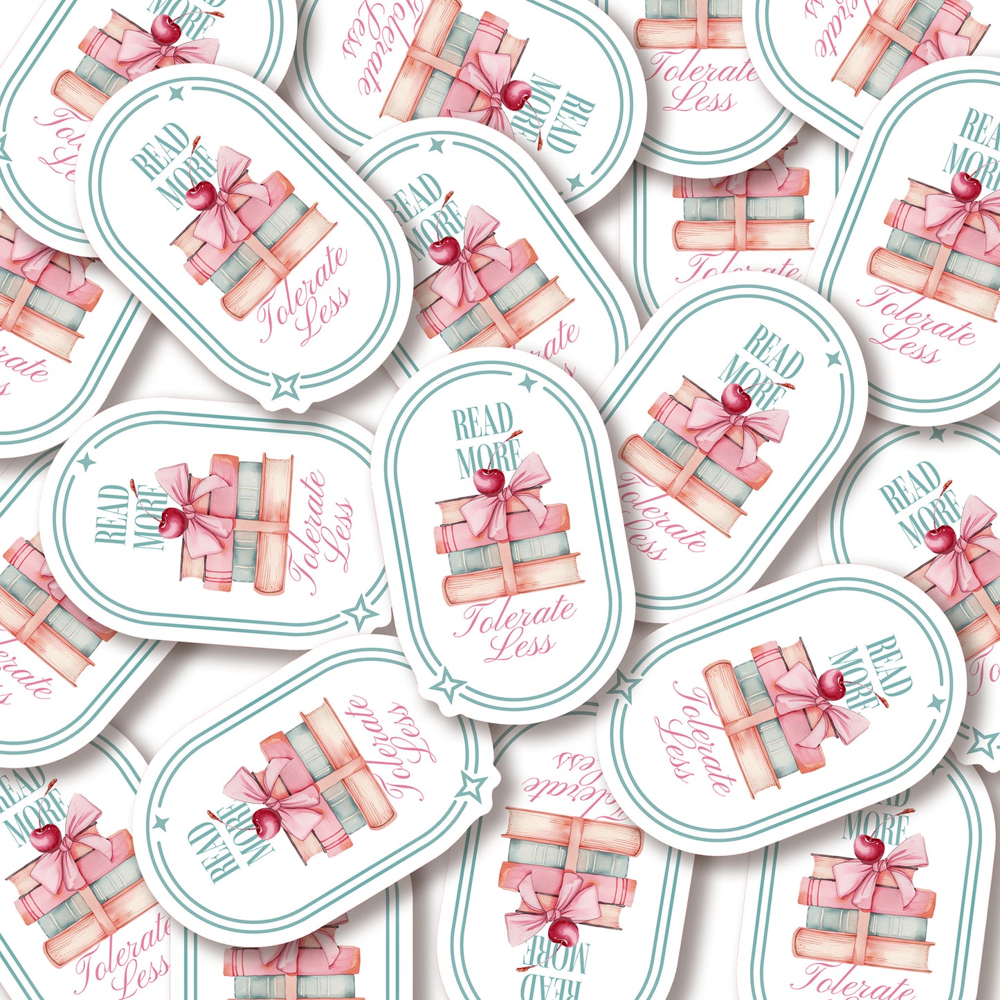 A pile of stickers with book-themed design and text that says Read More Tolerate Less  with a stack of books tied with a bow