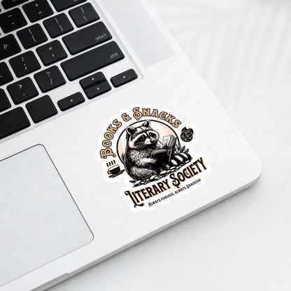Sticker with a raccoon design on a laptop
