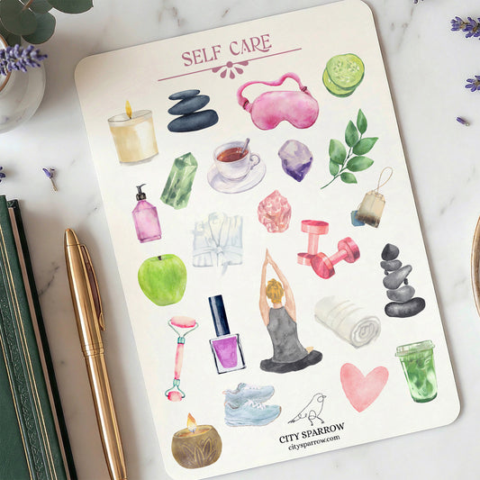 Sheet of self-care themed stickers on a notebook with a pen and flowers.