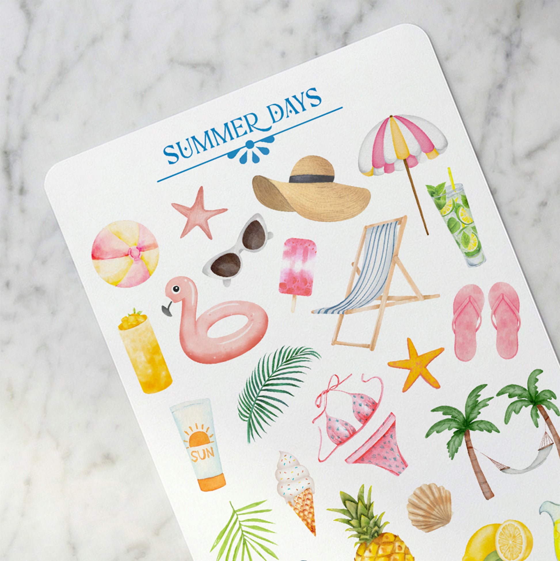 Sheet of summer-themed stickers with beach items on a marble surface