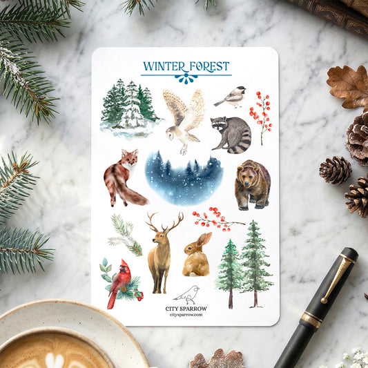 Sticker sheet titled 'Winter Forest' with various animals and nature elements on a marble surface.